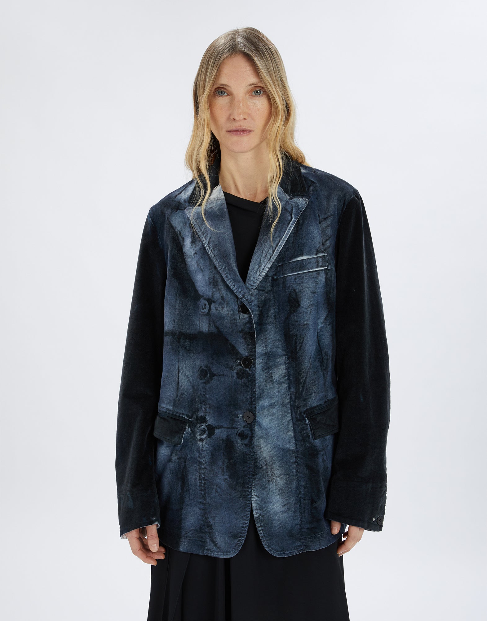 Front view of a person wearing the LISTEN TO jacket. The jacket features an oversized fit, blue-black ombre shading with a crinkle effect, notched collar, chest pocket, flap pockets, and button front closure.
